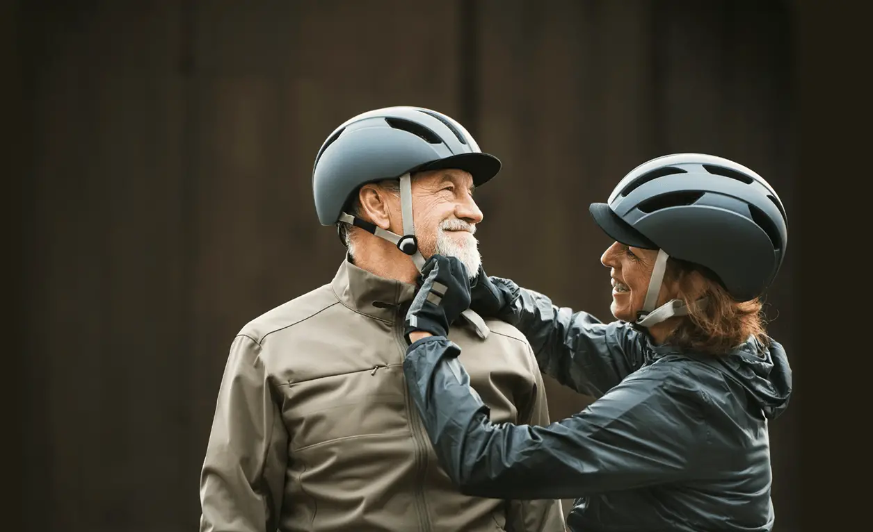 senior couple with bike helmets